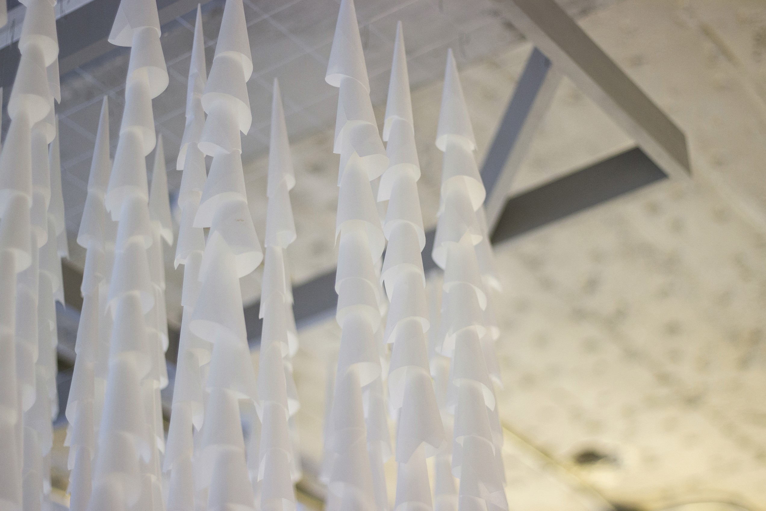 An art installation hanging in the office lobby, each cone representing 10 participants enrolled in the program (designed by the talented Ashley Monroe.)