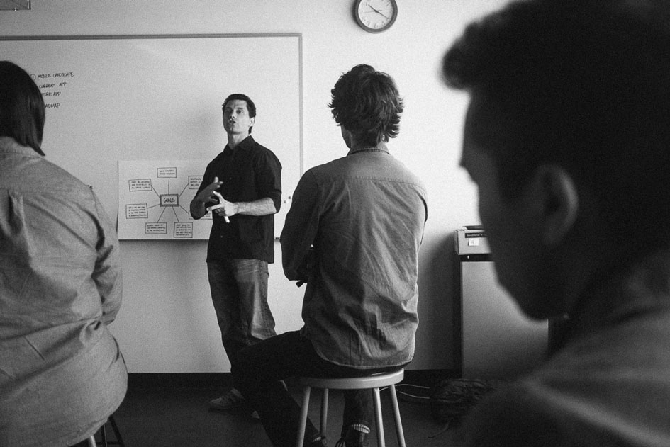 Jason presenting in a critique session about his work on Pinterest’s mobile navigation patterns.